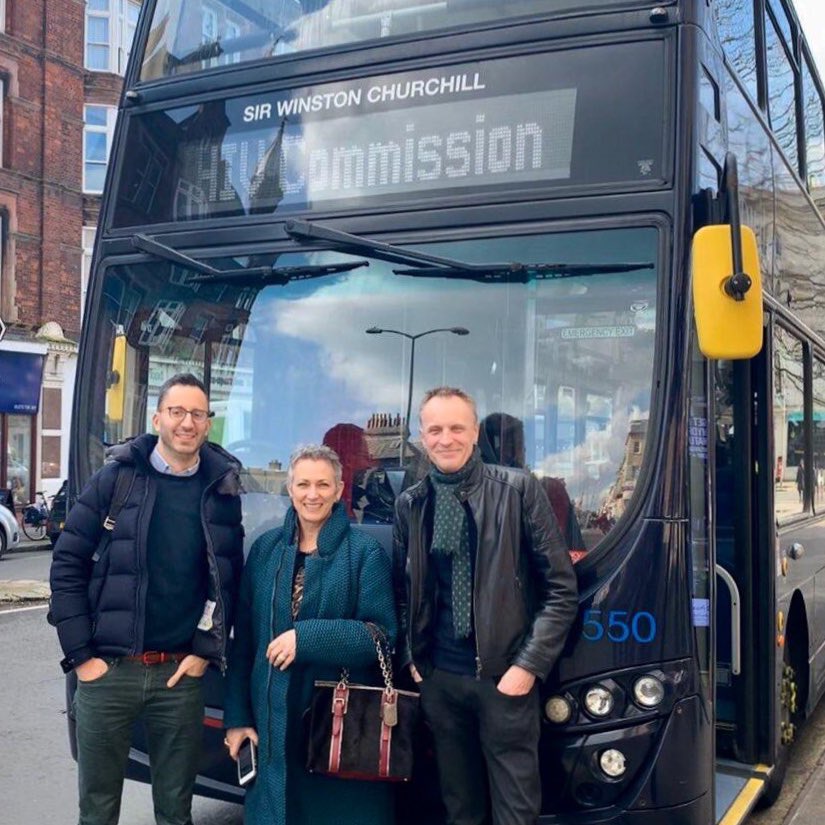 Commissioners in front of a Brighton bus